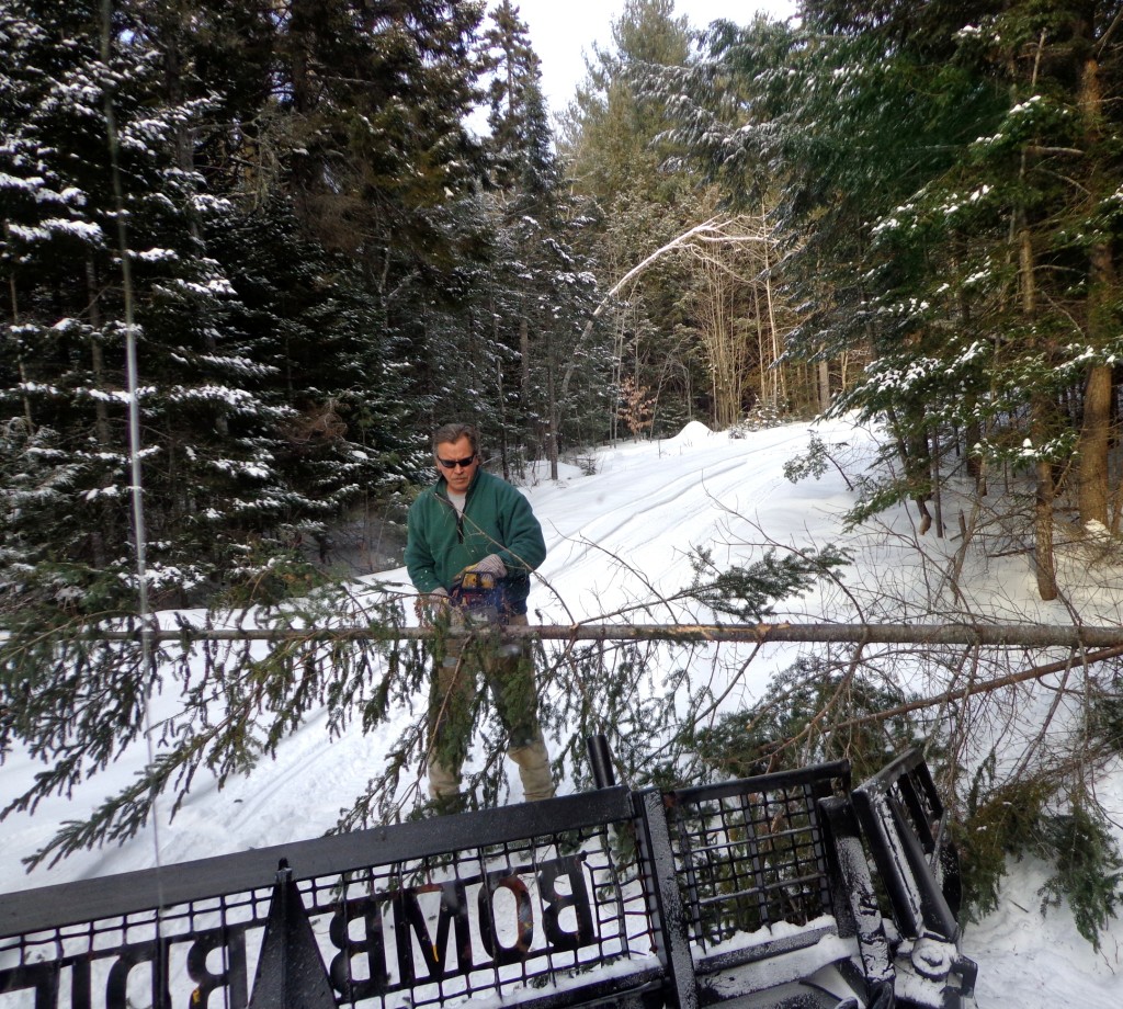 Rick Levasseur clearing snowmobile trail